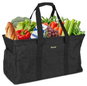 Reusable black grocery tote filled with fresh produce, bread, and milk.